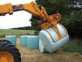 Wrapped Bale Clamp for handing wrapped silage bales.