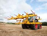 cta-Quad Bale Handling System - front and rear sections for carrying 12 round bales or 6 Heston bales at a time. Showing the hydraulic folding version.